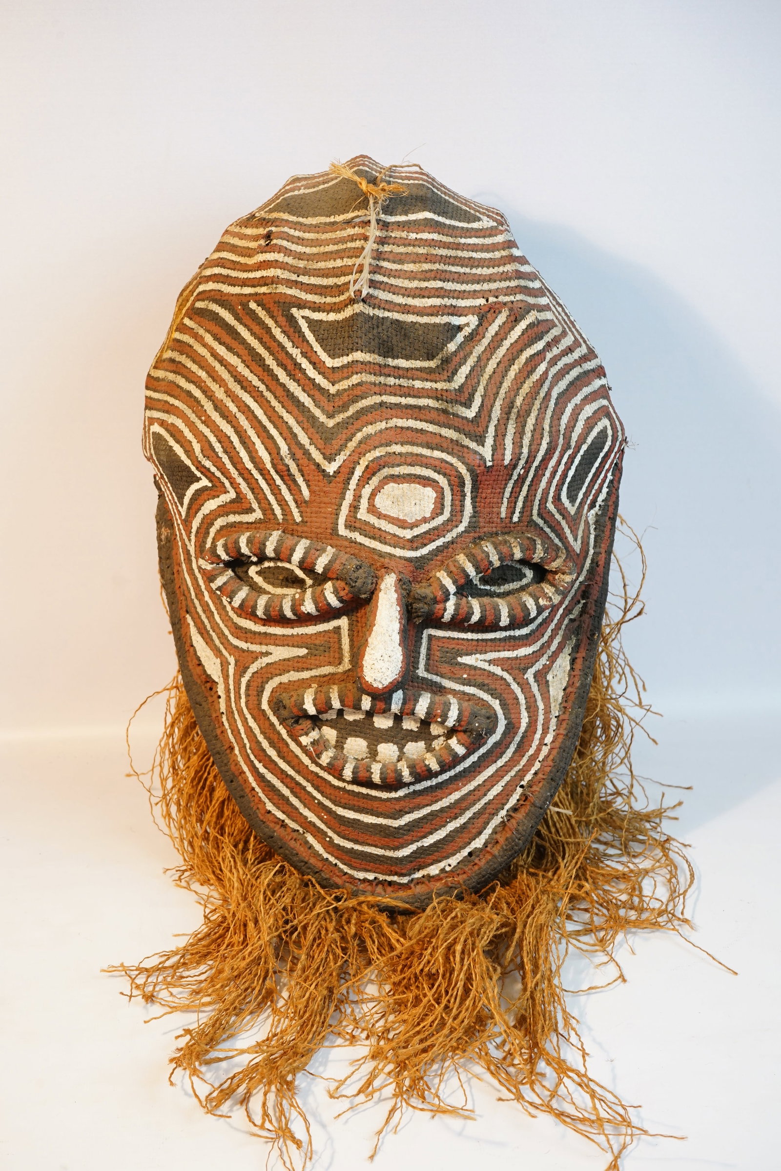 Vintage African Handmade Mask with Raffia, Hardened and Molded Burlap: Approximate size:20x10x13in Shipping: We offer in-house shipping services for most small items. This means that we will take care of packing and shipping the items directly to you. For larger or speci