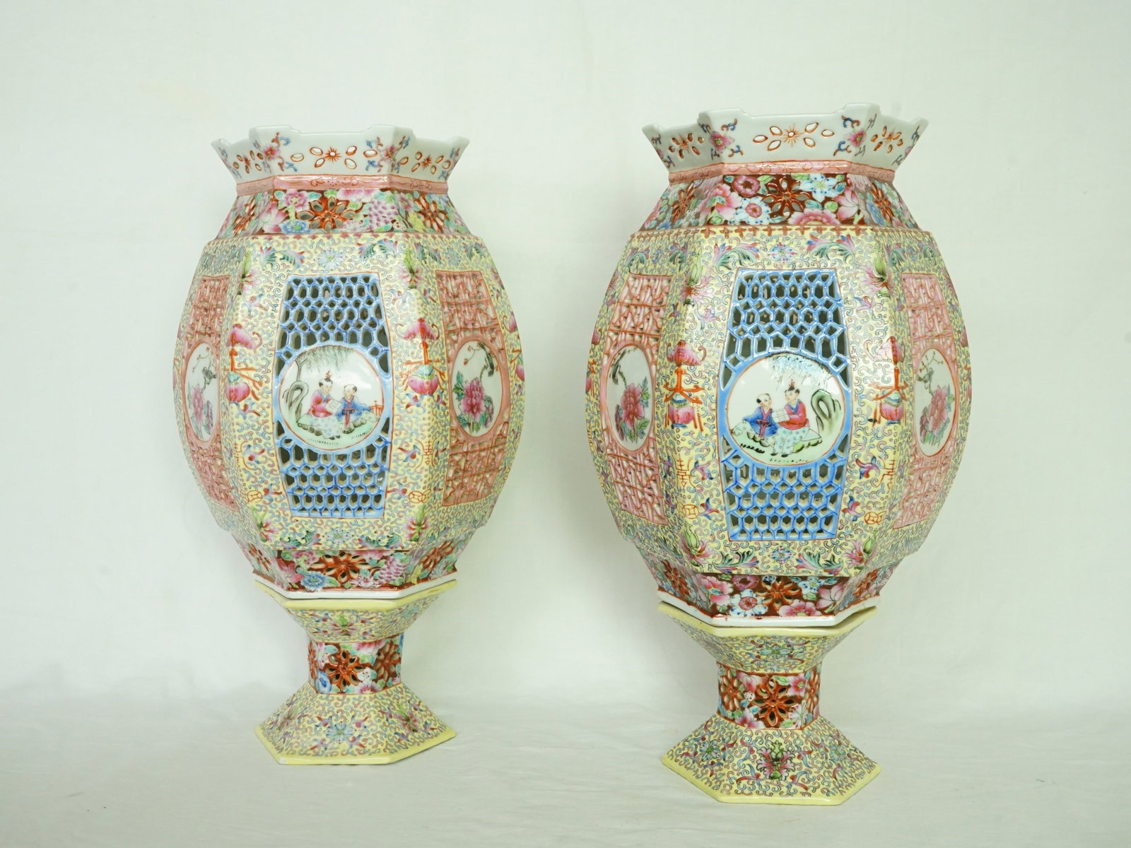 Pair of Chinese Famille Rose Porcelain Reticulated Lantern: Approximate size: 15.5x8.75x8.75 in Shipping: We offer in-house shipping services for most small items. This means that we will take care of packing and shipping the items directly to you. For larger 