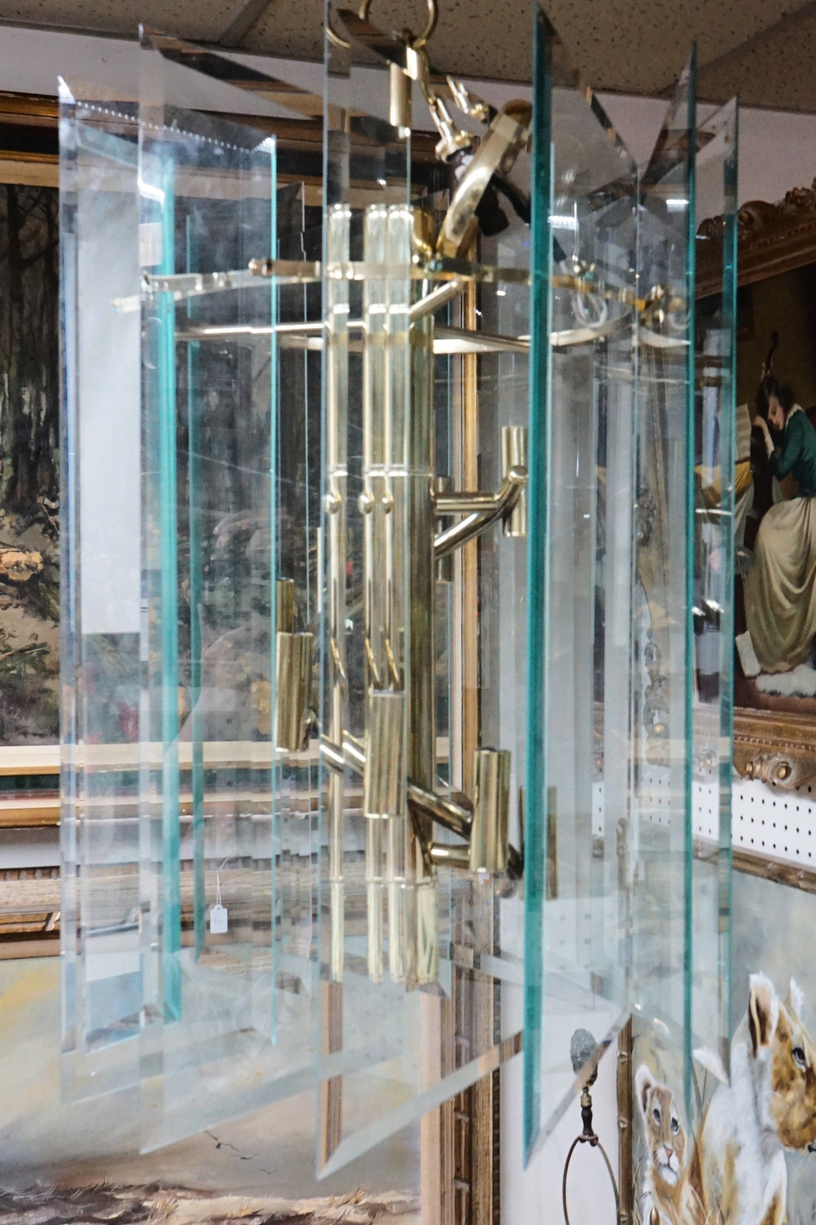 Vintage Mid-Century Modern Beveled Glass Panel Chandelier: Approximate size: 30x18x18 in Shipping: We offer in-house shipping services for most small items. This means that we will take care of packing and shipping the items directly to you. For larger or spe