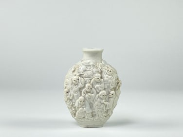 Chinese White Glazed  Moulded With 'Luohan'  In Relief  Snuff Bottle, 19th Century