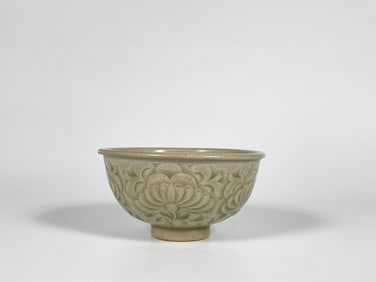 A Carved Yaozhou Celadon-Glazed 'Peony' Bowl