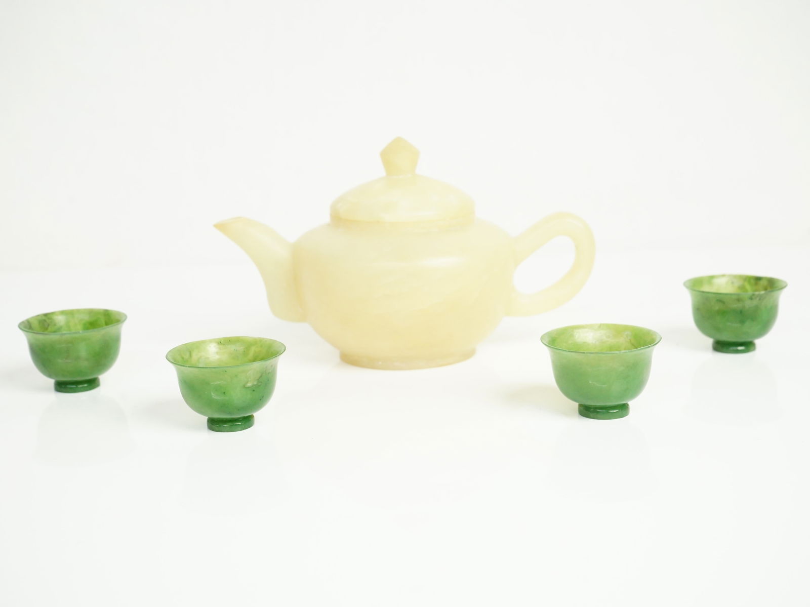 Chinese Carved Jade Teapot and 4 Teacups,Qing Dynasty: Approximate size:6.25x3.75x3.75 in/0.75x0.75x1 in Shipping: We offer in-house shipping services for most small items. This means that we will take care of packing and shipping the items directly to yo