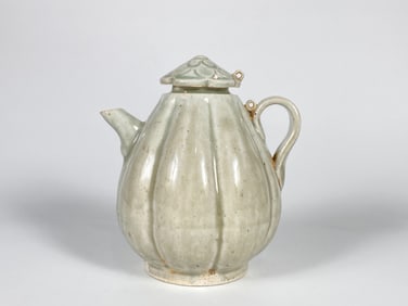 A Celadon Glazed Melon-Shaped Teapot and Cover