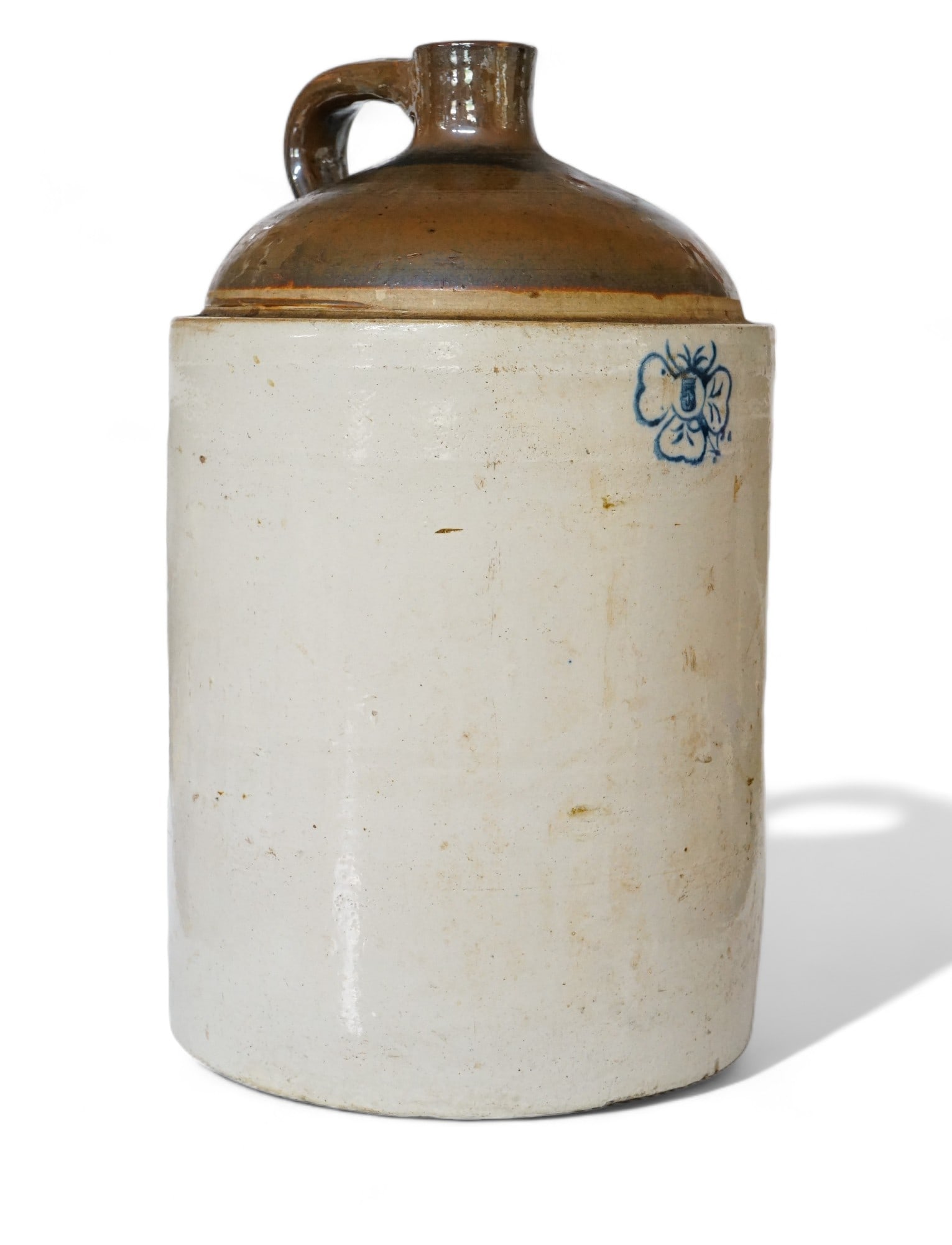 19th Century 5 Gallon Cloverleaf Stoneware Jug: Approximate size: 19x11.25x11.25 in Shipping: We offer in-house shipping services for most small items. This means that we will take care of packing and shipping the items directly to you. For larger