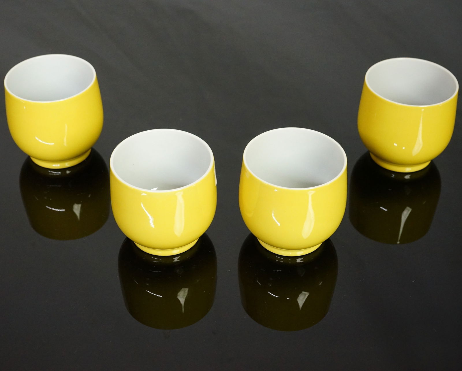 Group of 4 Chinese Yellow Glazed Cups With Yongzheng Marks: Approximate size: 2.25x2.25x2.25 in Shipping: We offer in-house shipping services for most small items. This means that we will take care of packing and shipping the items directly to you. For larger