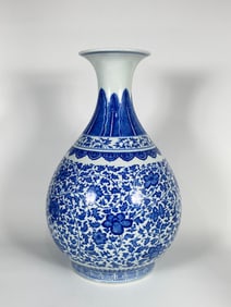 A Chinese Blue and White 'Peony Scroll' Bottle Vase, Qianlong Mark