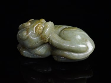 A Large Celadon and Russet Jade 'Buddhist Lion' Qing Dynasty, 19th Century