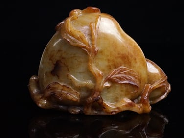 A Yellow and Russet Jade 'Peach' Carving Qing Dynasty, 19th Century