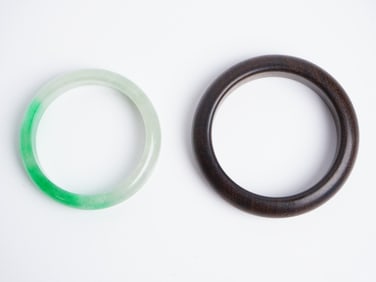 A Chinese Jadeite Bangle and A Rosewood Bangle