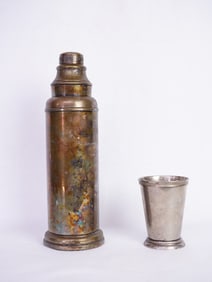 A Sliver Plated Hot Water Bottle and A Cup