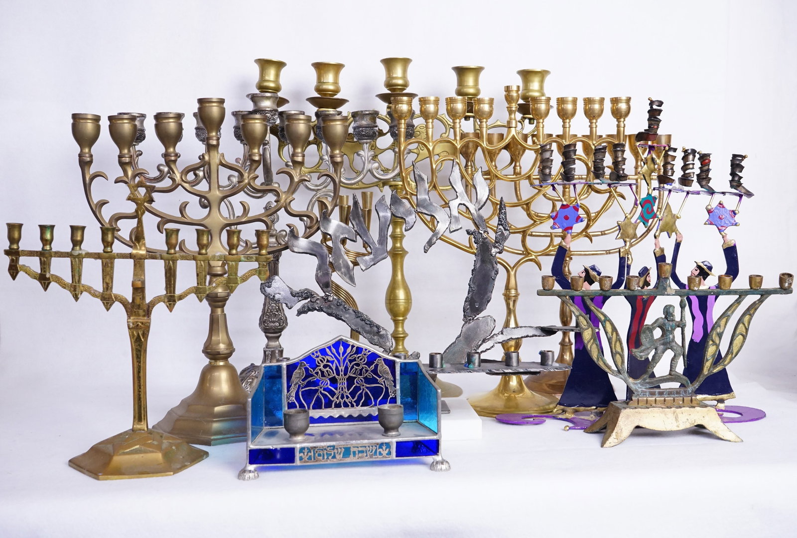 Group of 10 Vintage Metal Judaica Menorahs: Approximate size: largest H:15.5 in /smallest H:4.25 in Shipping: We offer in-house shipping services for most small items. This means that we will take care of packing and shipping the items directly
