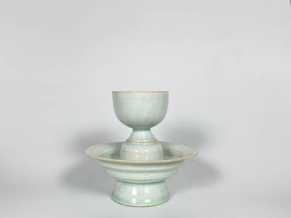 A Qingbai Cup and Cupstand Song Dynasty: Approximate size: H: 5 1/2 in Shipping: We offer in-house shipping services for most small items. This means that we will take care of packing and shipping the items directly to you. For larger or spe