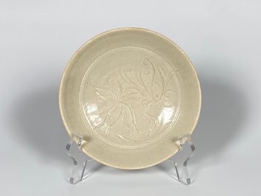 A Carved Dingyao White-Glazed 'Lotus' Bowl