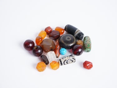 Group of 21 Chinese Mixed Agate and Beeswax Beads