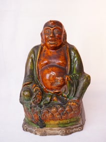 A Polychrome Enamelled Figure of Budai, Ming Dynasty
