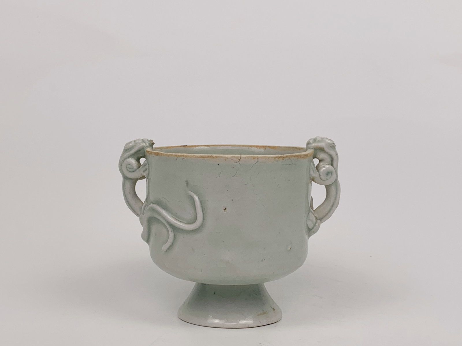 Chinese Hutian Kiln 'Dragon'-Handled Porcelain Cup: Approximate size:3 3/8x3 3/8 in (HxDia) Shipping: We offer in-house shipping services for most small items. This means that we will take care of packing and shipping the items directly to you. For lar