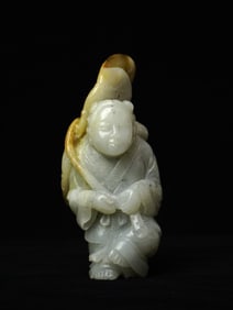 A Celadon Jade Figure of Boy Holding Lotus , Qing Dynasty