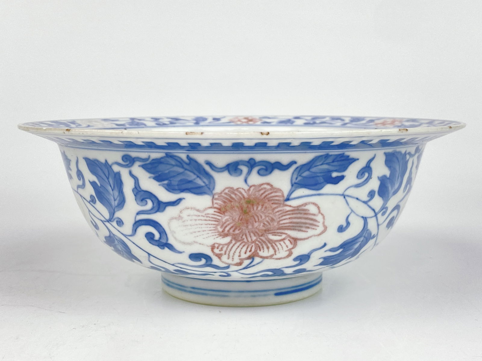 A Blue and White and Copper Red 'Floral' Bowl: Approximate size: 2 7/8x7 1/4 in (HxDia) Shipping: We offer in-house shipping services for most small items. This means that we will take care of packing and shipping the items directly to you. For la