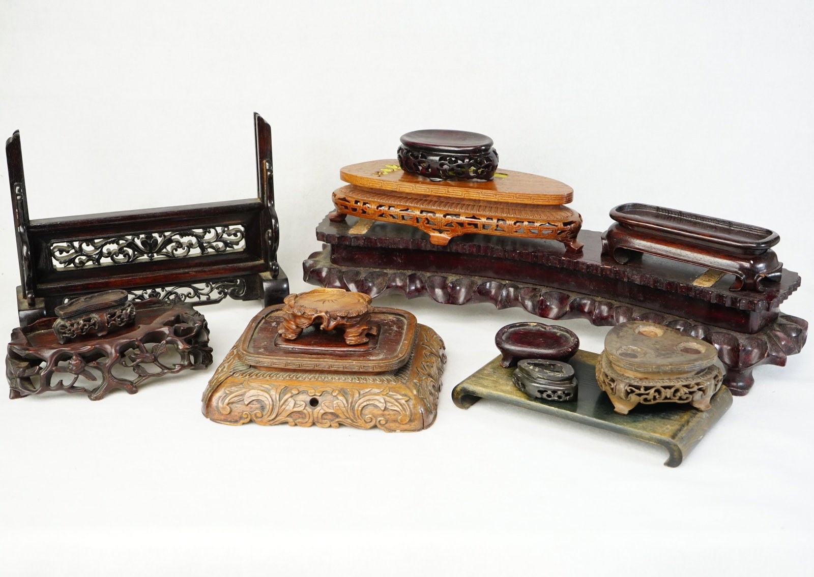Group of Chinese Wood Stands: Approximate size: largest 18x4x3.75 in/smallest 2.25x1.25x0.25 in Shipping: We offer in-house shipping services for most small items. This means that we will take care of packing and shipping the item