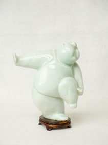 A Chinese Celadon Glazed Porcelain Figure