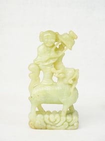 A Chinese Jade Carving of A Girl Riding A Mythical Beast
