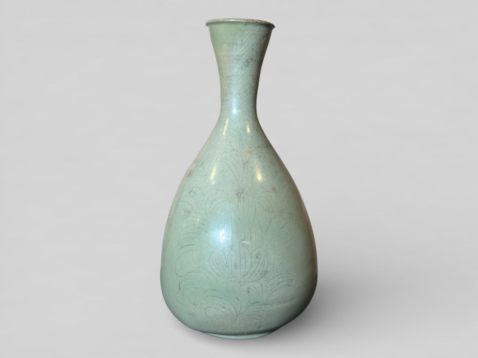 Antique Korean Celadon Porcelain Vase With Incised Lotus Motif: Antique korean porcelain vase with incised lotus décor, 10"ht, old restoration to rim. Shipping: We offer in-house shipping services for most small items. This means that we will take care of packing