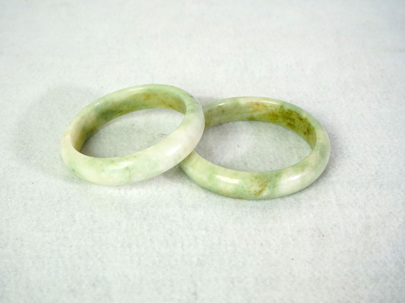 Two Chinese Jade Bracelets: Approximate size:out dia 3 in,inner dia 2.5 in Shipping: We offer in-house shipping services for most small items. This means that we will take care of packing and shipping the items directly to you.