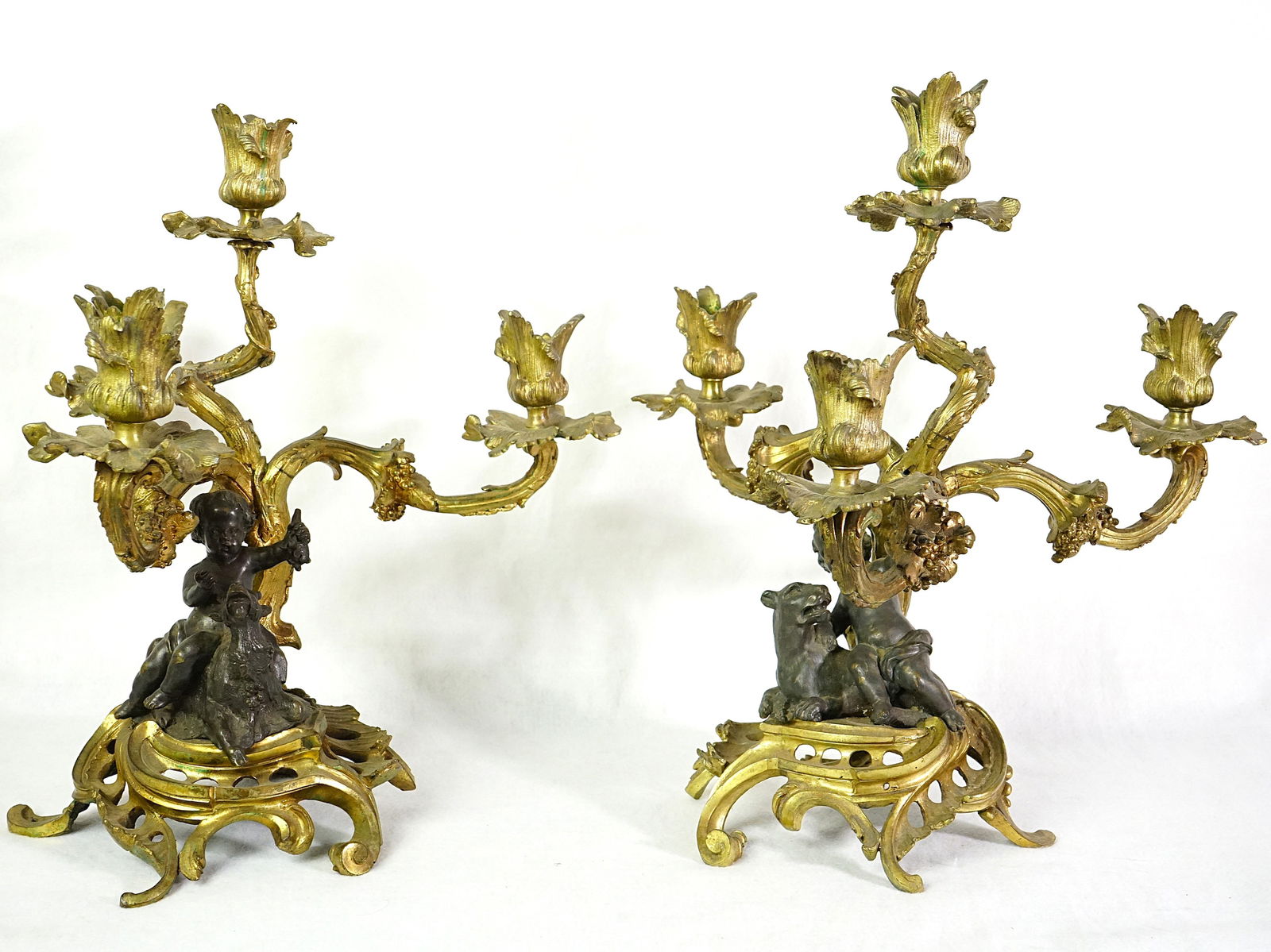 Pair of Louis XV Style 19th Century French Bronze and Gilt Candelabras: Approximate size:14x12.5x12.5 in Shipping: We offer in-house shipping services for most small items. This means that we will take care of packing and shipping the items directly to you. For larger or