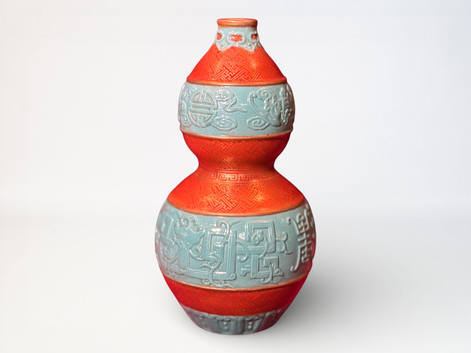 Chinese Molded Double Gourd Porcelain Vase: Chinese double gourd porcelain vase with molded design, gilt mark, 6.25"ht Shipping: We offer in-house shipping services for most small items. This means that we will take care of packing and shipping