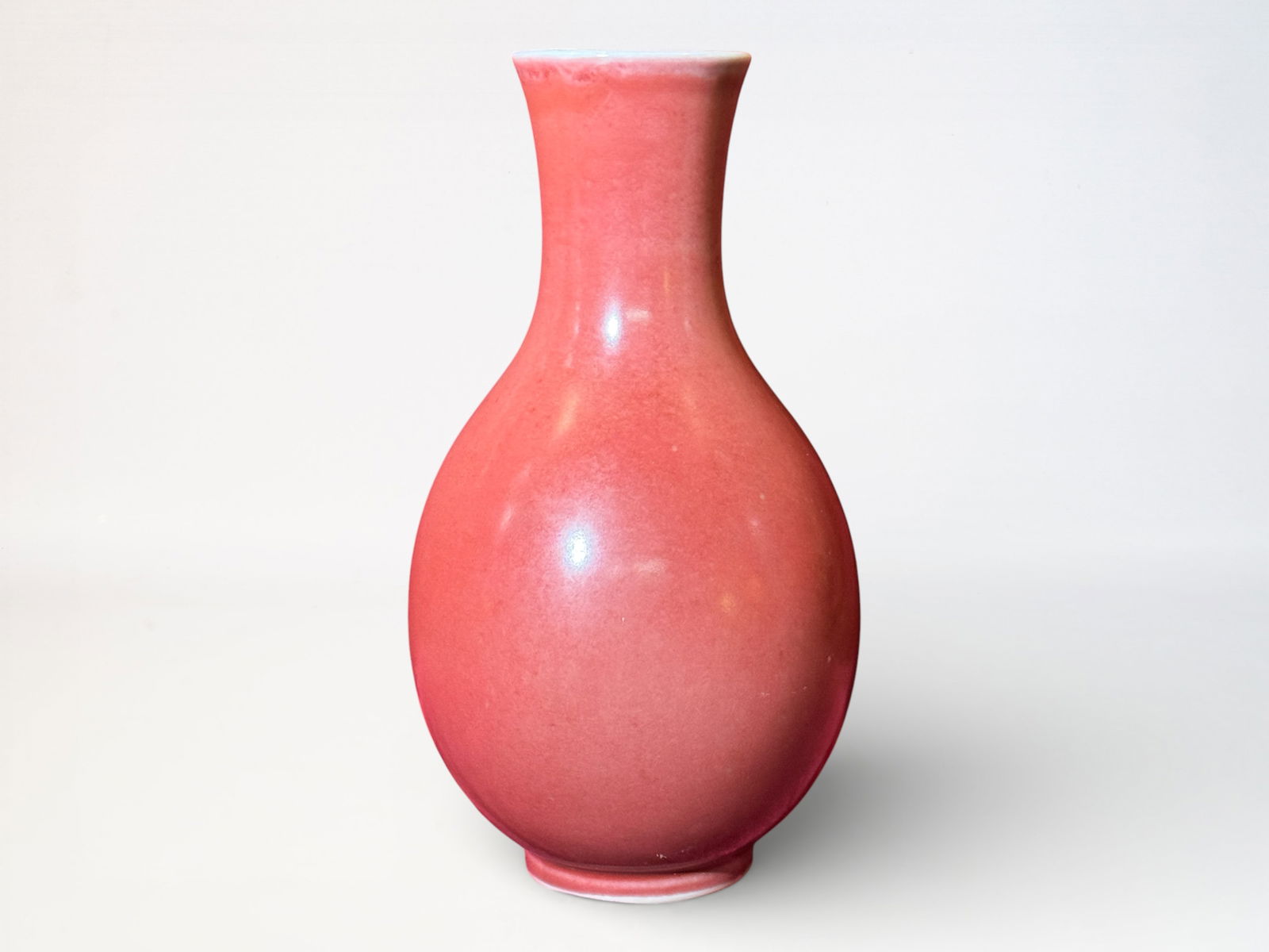 Chinese Red Glazed Porcelain Vase: Chinese oxblood porcelain vase, 9.5"ht Shipping: We offer in-house shipping services for most small items. This means that we will take care of packing and shipping the items directly to you. For larg