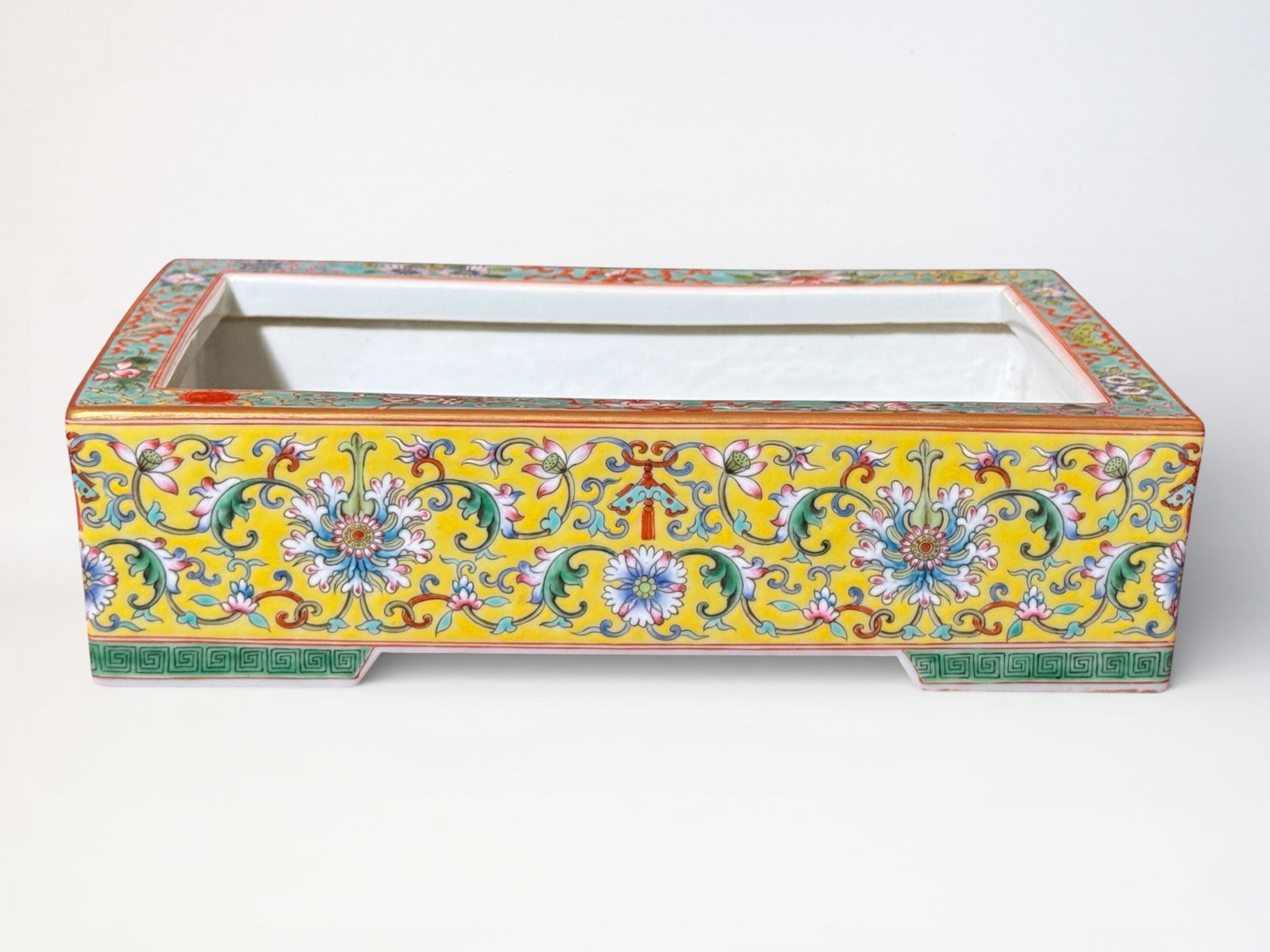 Chinese Yellow Ground Famille Rose Porcelain Planter: Chinese yellow porcelain planter with famille rose décor, 9.5" by 6" and 2.5"ht Shipping: We offer in-house shipping services for most small items. This means that we will take care of packing and sh