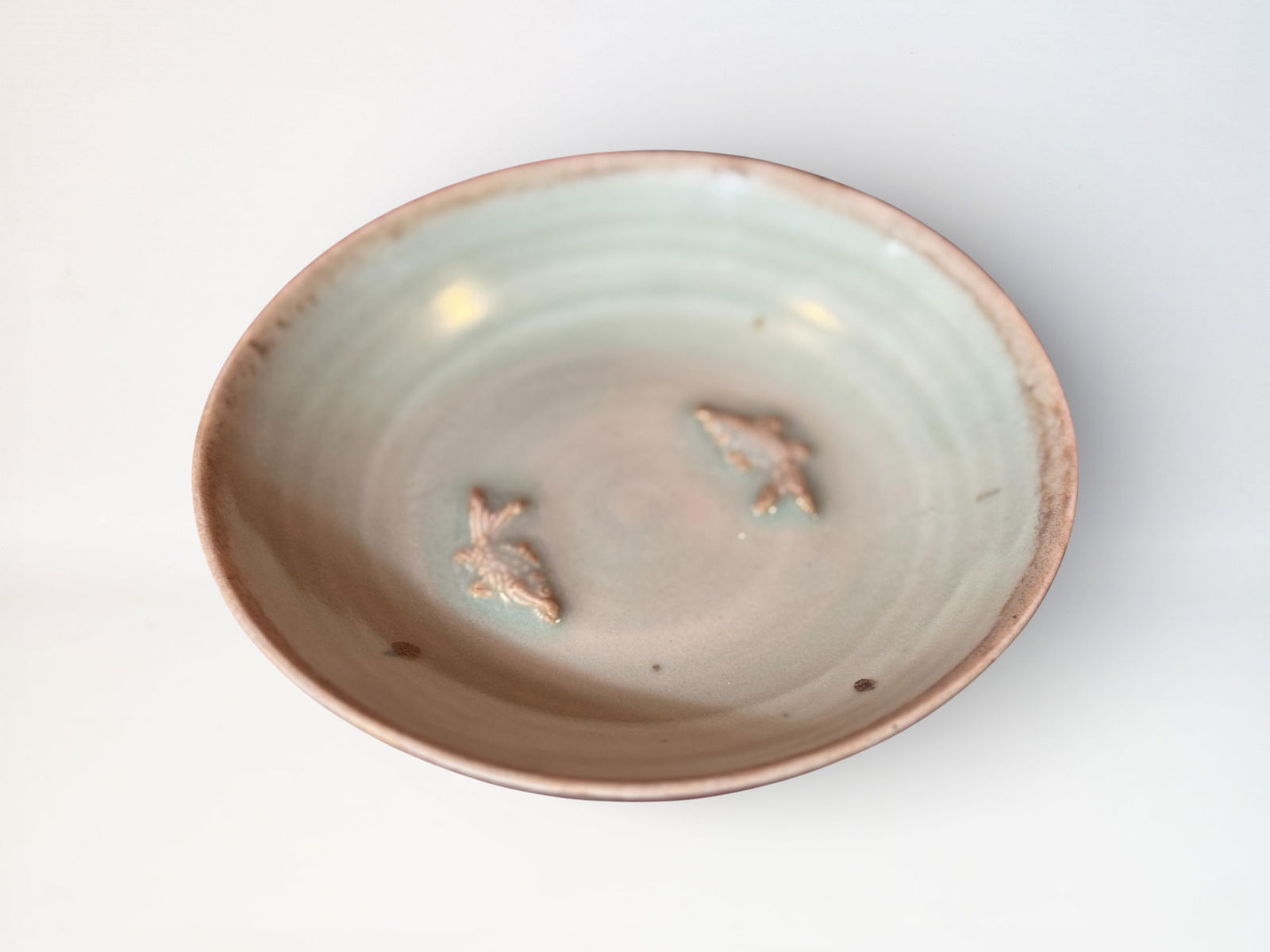 Chinese Celadon Glazed 'Two Fish' Porcelain Dish: Chinese celadon porcelain dish with two molded fish design, 5.75"dia Shipping: We offer in-house shipping services for most small items. This means that we will take care of packing and shipping the i