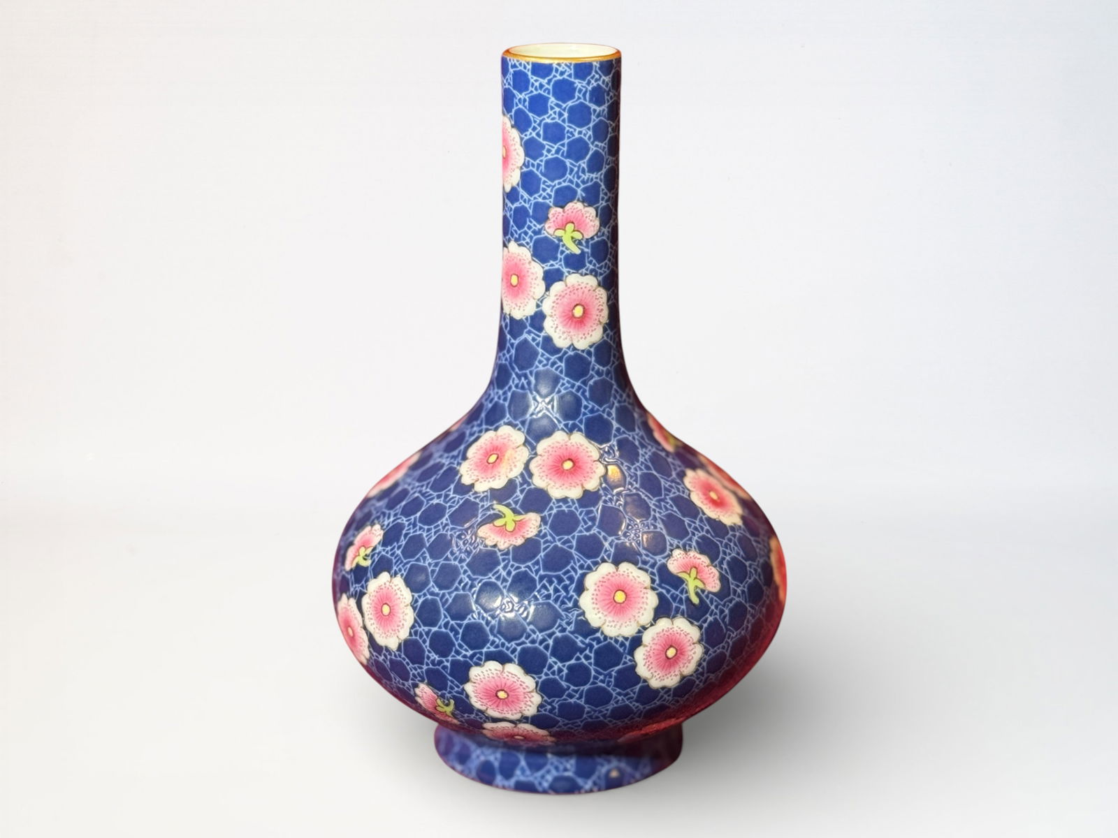 Chinese Polychrome 'Plum Blossom' Porcelain Vase: Chinese bkeu enamled porcelain vase with pink plum blossom design, 6"ht Shipping: We offer in-house shipping services for most small items. This means that we will take care of packing and shipping th