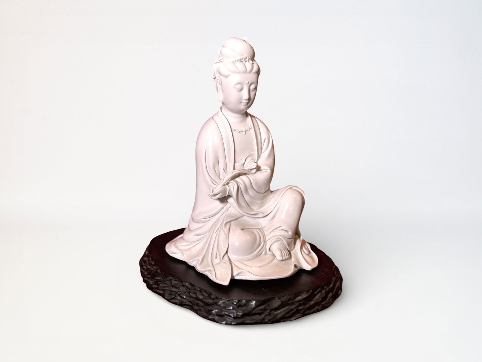 Chinese Dehua Figure of A Seated Kuanyin With Hardwood Stand: Chinese dehua porcelain kuayin on stand, 9"ht Shipping: We offer in-house shipping services for most small items. This means that we will take care of packing and shipping the items directly to you. F