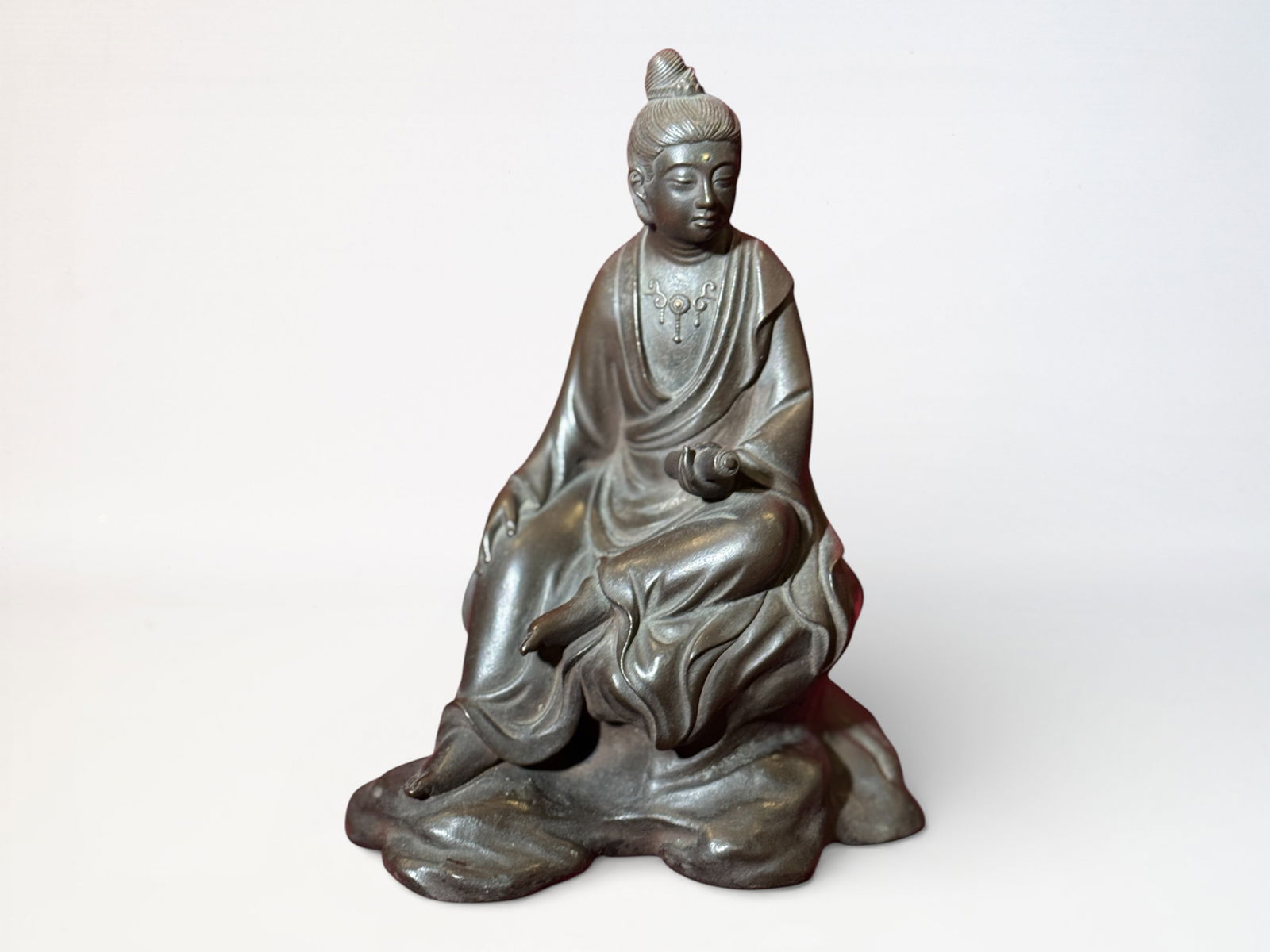 Japanese Bronze Kuanyin With Gold Bead: Japanese bronze seated kuanyin with gold bead inlay at forehead, signed, 7"ht Shipping: We offer in-house shipping services for most small items. This means that we will take care of packing and shipp