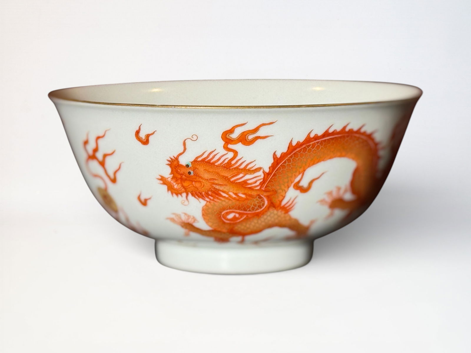 Chinese Iron-Red Decorated 'Dragon' Bowl: Chinese porcelain bowl with iron red painting of dragon chasing flaming pearl, 5.75"dia 2.6"ht Shipping: We offer in-house shipping services for most small items. This means that we will take care of