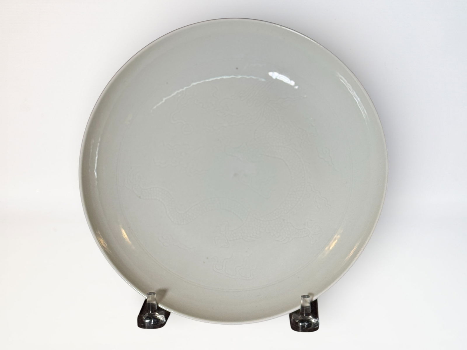 Chinese Incised White-Glazed ‘Dragon’ Plate: Chinerse white glazed porcelain dish with incised dragon motif, 8.75"dia Shipping: We offer in-house shipping services for most small items. This means that we will take care of packing and shipping t