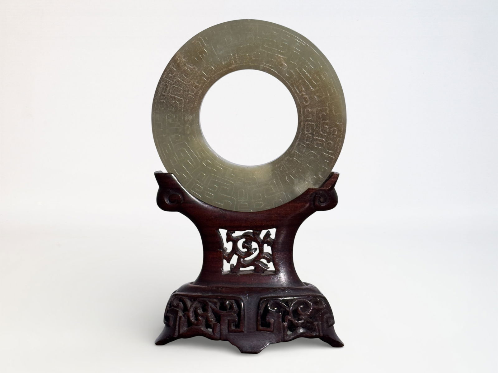 Chinese Carved Jade Pi on Stand: Chinese Jade Pi on Hardwood Stand, jade 2.95"dia, chip on the hardwood stand Shipping: We offer in-house shipping services for most small items. This means that we will take care of packing and shippi