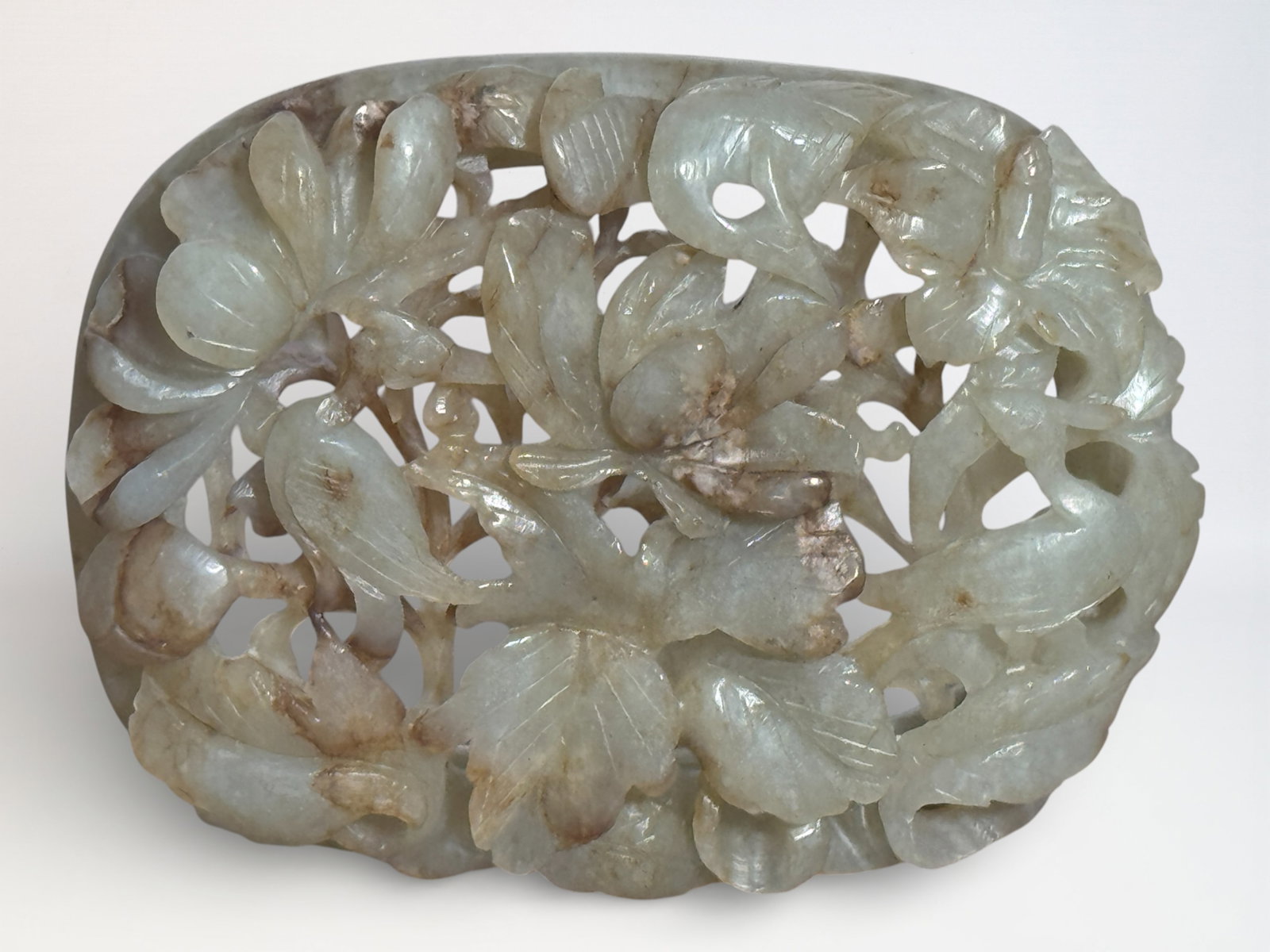 Chinese Carved Celadon Jade 'Flower and Bird' Plaque: Chinese oval jade plaque withm reticulated bird floral design, 3.5"w Shipping: We offer in-house shipping services for most small items. This means that we will take care of packing and shipping the i