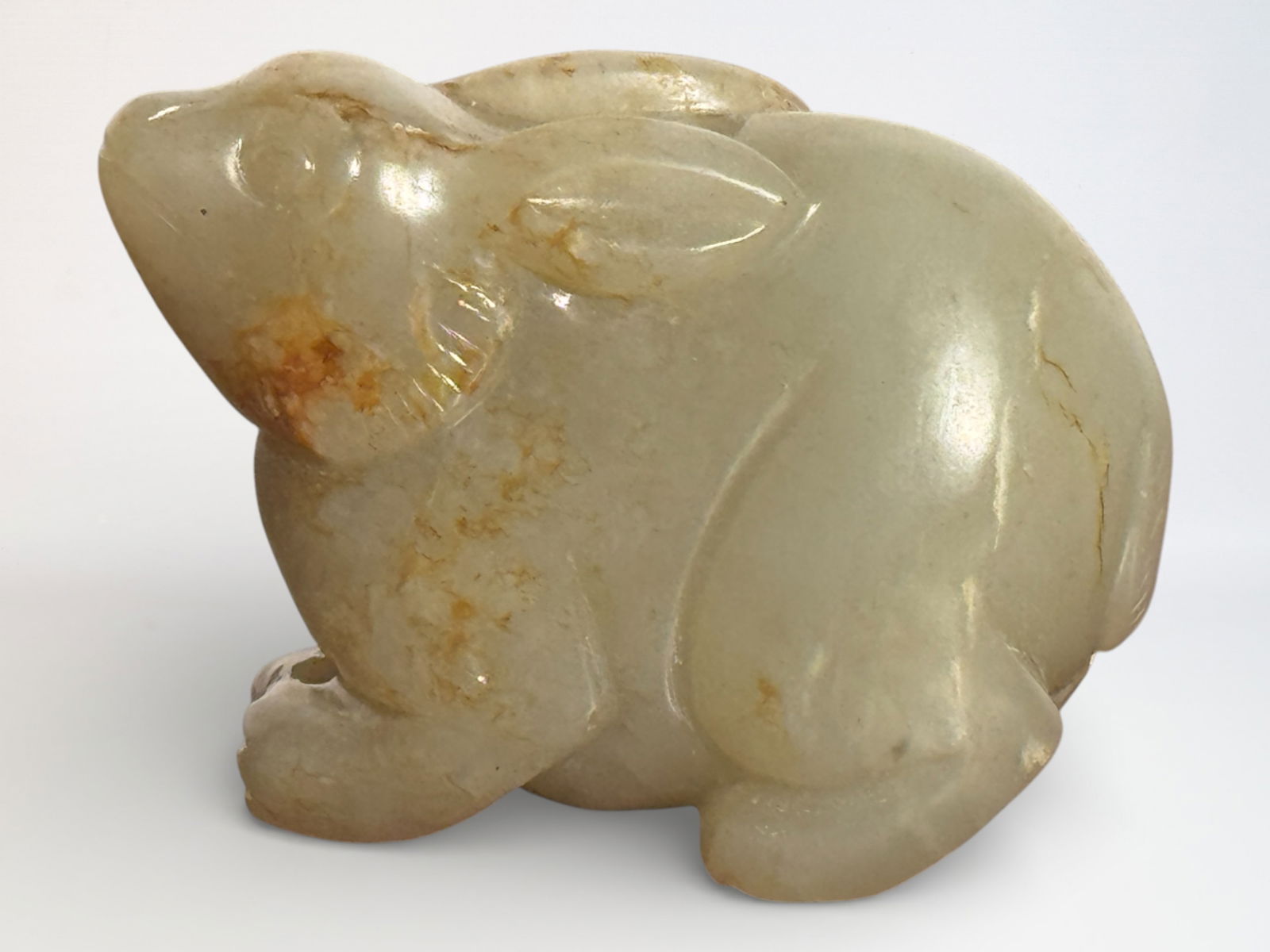 Chinese Carved Celadon and Russet Jade Rabbit: Chinese jadse rabbit with area yellow skin, 1.6"w Shipping: We offer in-house shipping services for most small items. This means that we will take care of packing and shipping the items directly to