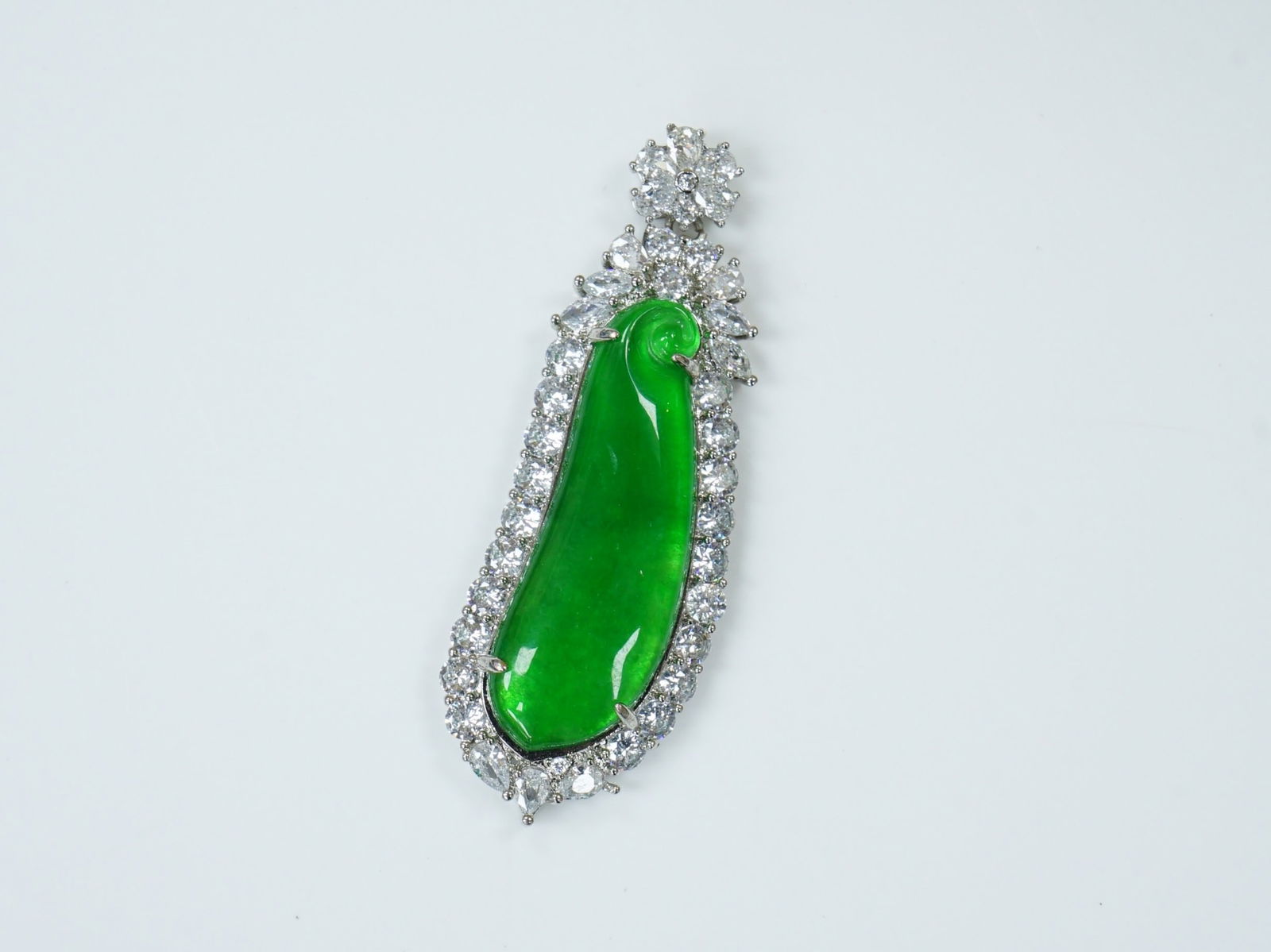 A Jadeite and Diamond Pendant: Approximate size:2.5x1x3/8 in Shipping: We offer in-house shipping services for most small items. This means that we will take care of packing and shipping the items directly to you. For larger or spe