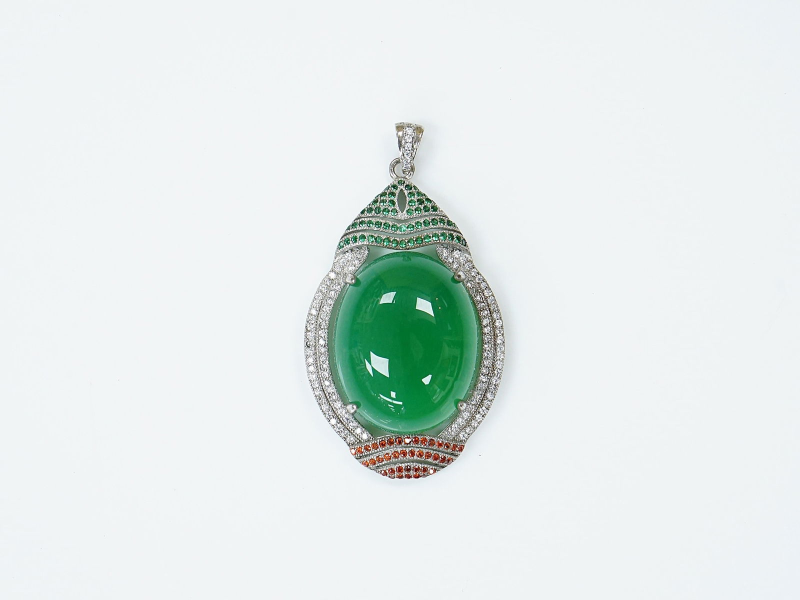 A Jadeite and Diamond Round Pendant: Approximate size:2x1 1/8x5/8 in Shipping: We offer in-house shipping services for most small items. This means that we will take care of packing and shipping the items directly to you. For larger or s