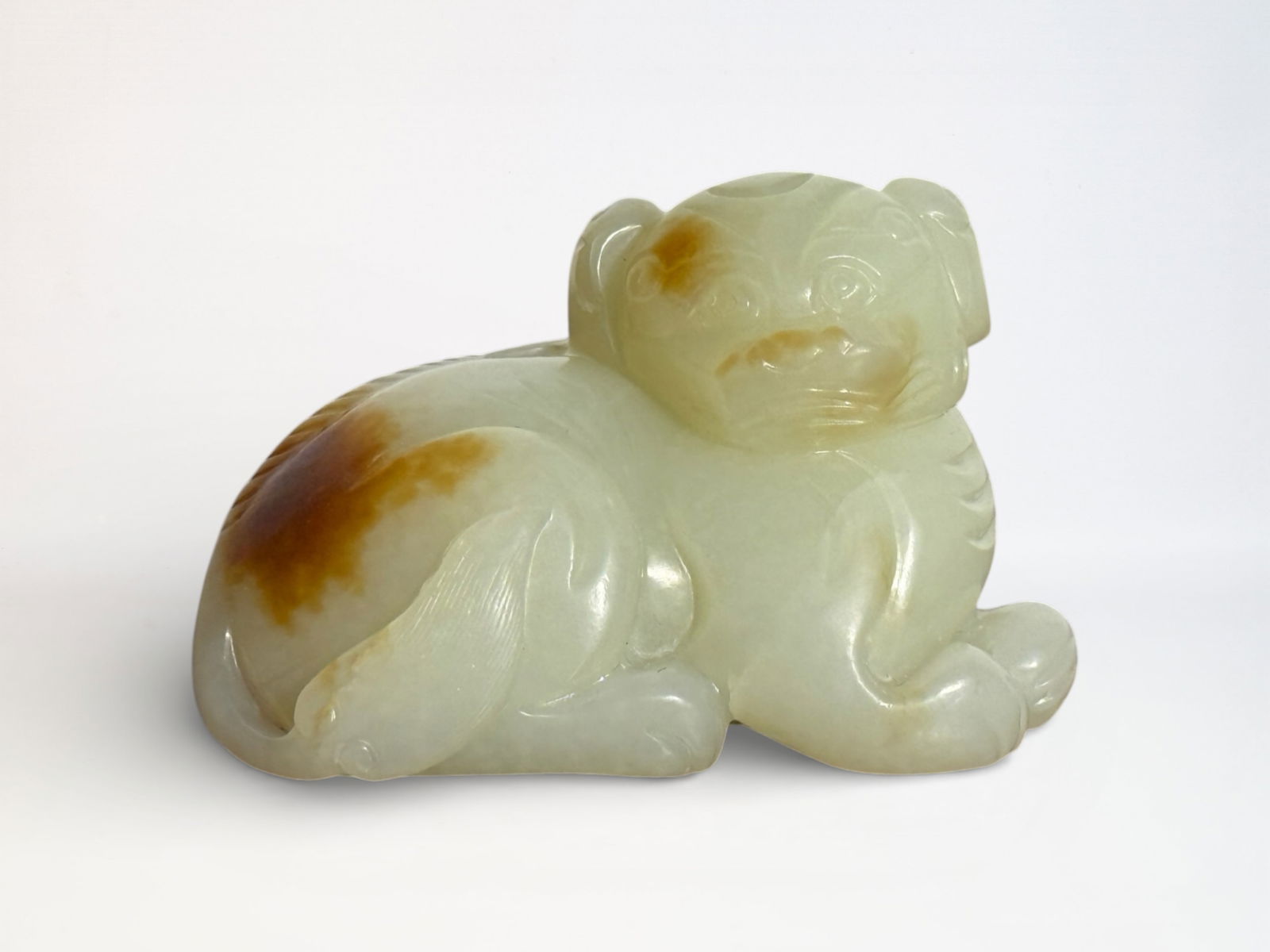 Chinese Carved White Jade Foo Lion: Chinese white jade foo lion with yellow skin, 3.25"L 2"ht Shipping: We offer in-house shipping services for most small items. This means that we will take care of packing and shipping the items direct