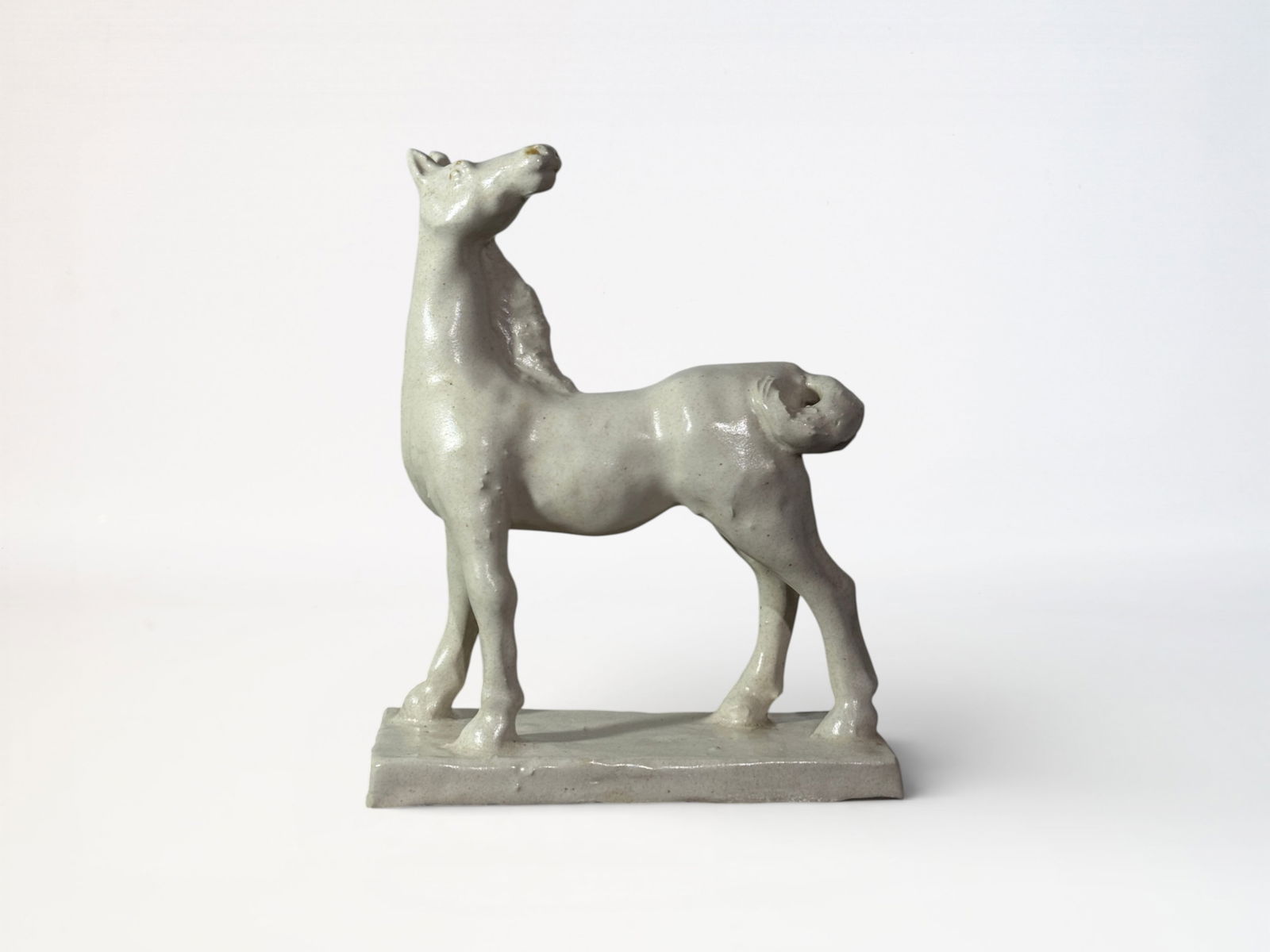 Japanese Studio Porcelain Model of a Horse: Japanese studio porcelain model of a standing horse, with wood box, impressed artist seal, 8.25"ht 7"w Shipping: We offer in-house shipping services for most small items. This means that we will take