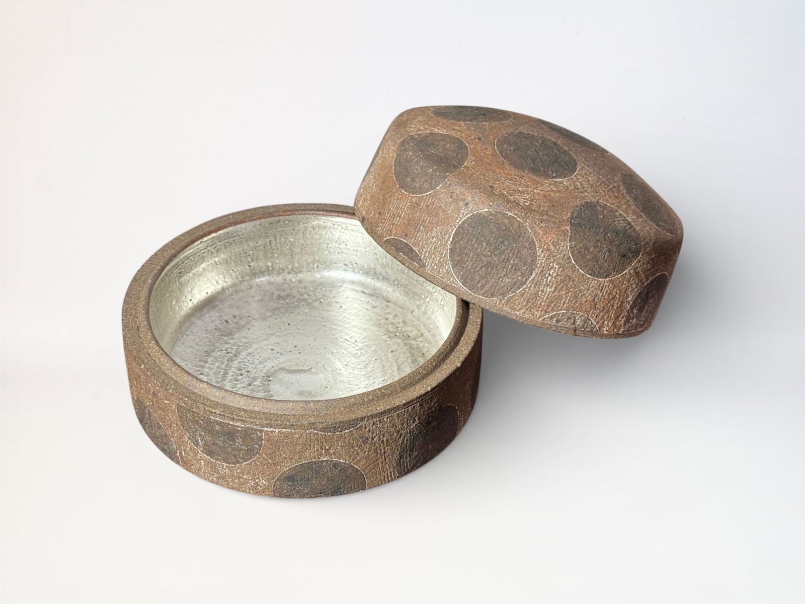 Japanese Studio Pottery Box with Metallic Silver Interior: Japanese studio pottery box with metallic silver interior, signed, with original wood storage box, 5.75"dia 4.5"ht Shipping: We offer in-house shipping services for most small items. This means that w