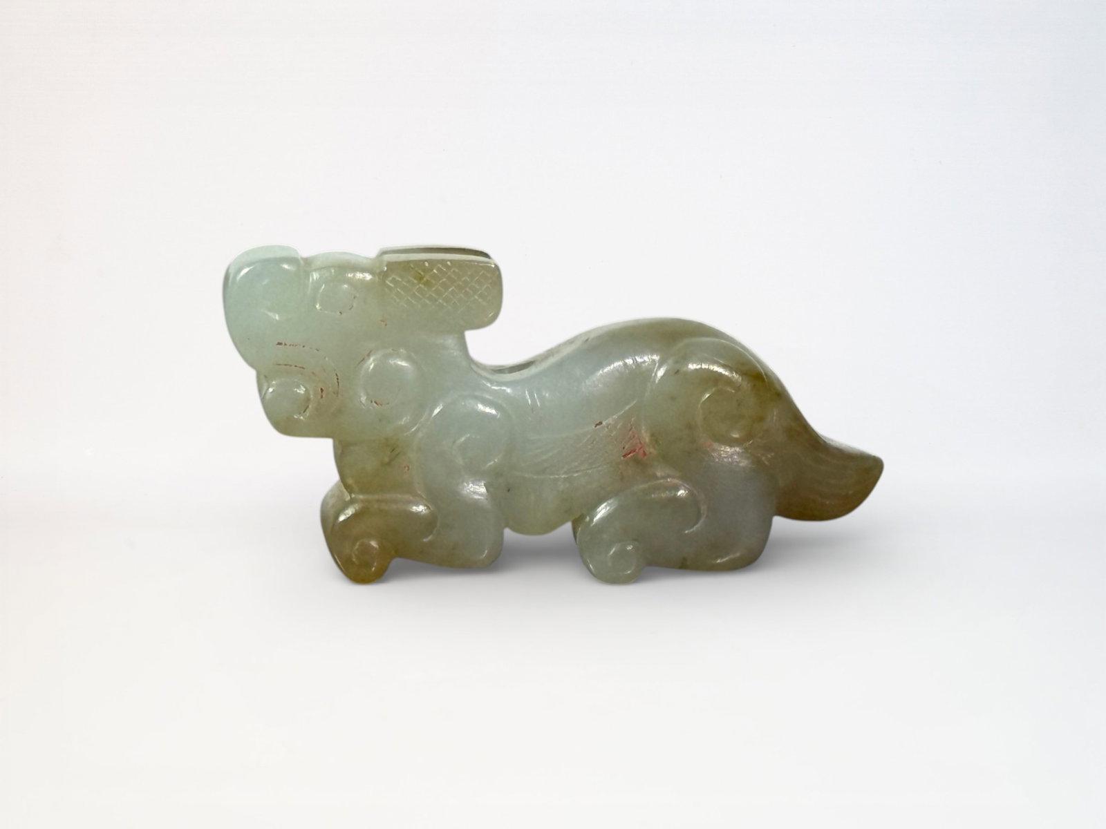 Chinese Carved Celadon and Russet Jade Tiger: Chinese jade tiger, 2.25"L Shipping: We offer in-house shipping services for most small items. This means that we will take care of packing and shipping the items directly to you. For larger or