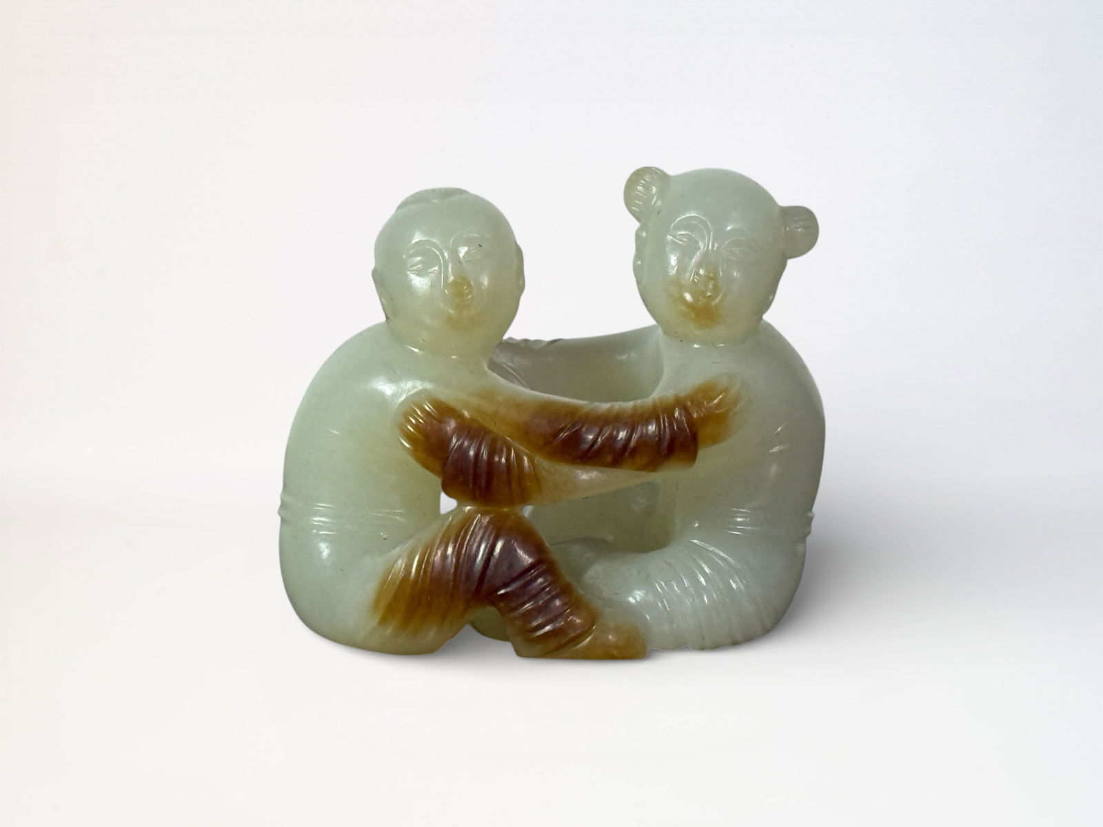 Chinese Carved Celadon and Russet Jade 'Twin Boys' Group: Chinese jade carving of two boy, 2.2"L 1.8"ht Shipping: We offer in-house shipping services for most small items. This means that we will take care of packing and shipping the items directly to you.