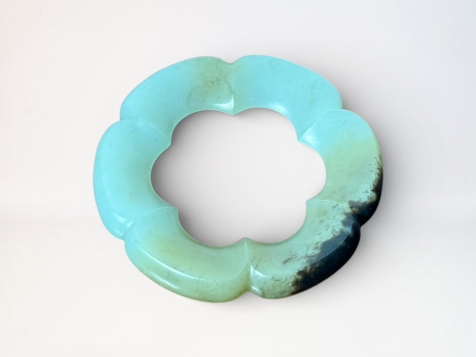 Chinese Carved Lobbed Jade Ring: Chinese lobbed jade ring, 2"dia Shipping: We offer in-house shipping services for most small items. This means that we will take care of packing and shipping the items directly to you. For larger or
