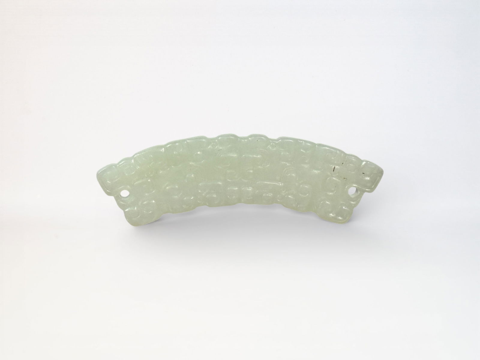 Chinese Carved Jade Arched Form 'Huang' Pendant: Chinese arched jade huang with carving, 3"L Shipping: We offer in-house shipping services for most small items. This means that we will take care of packing and shipping the items directly to you. For
