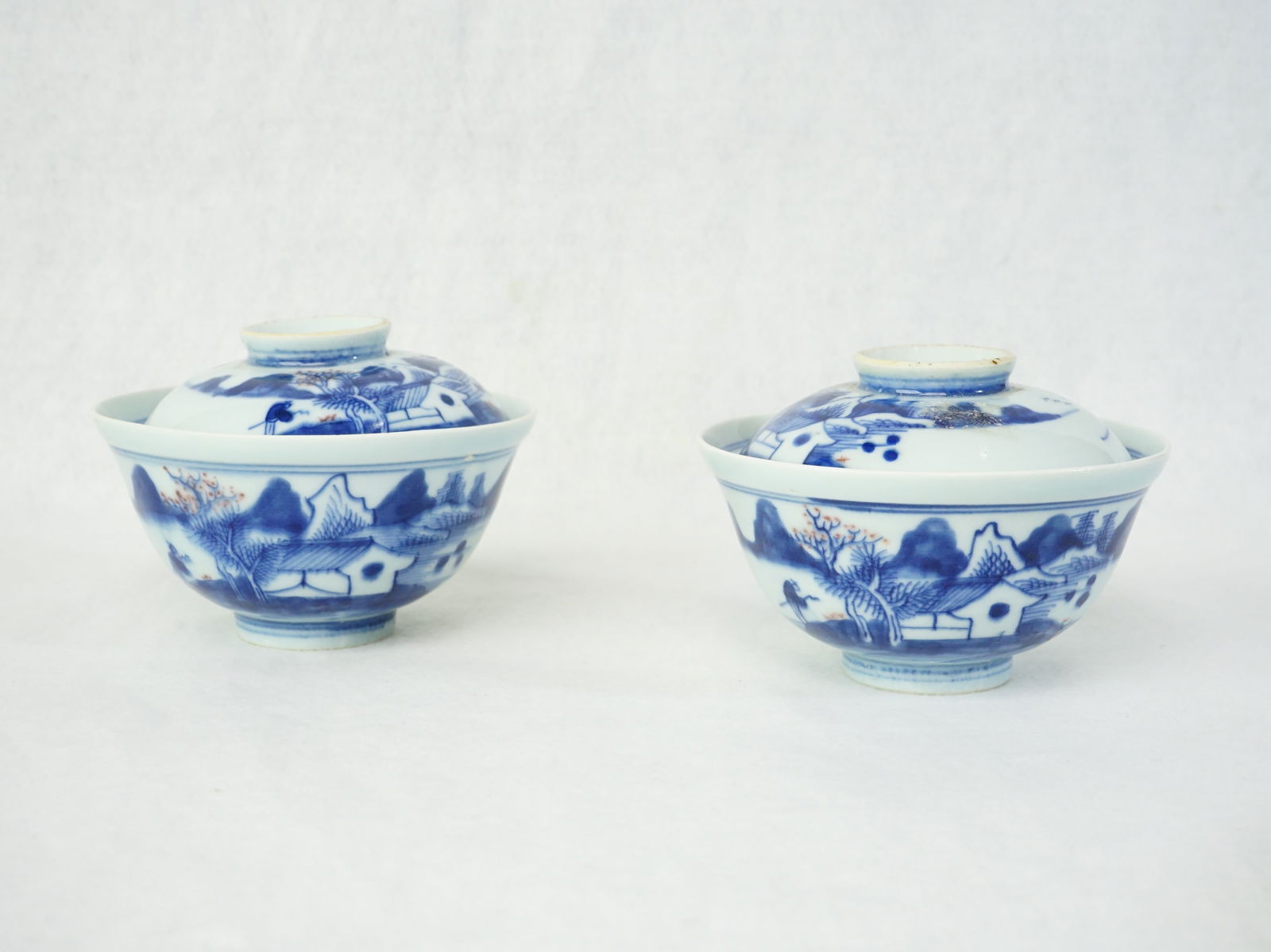 Pair of Chinese Underglaze Blue and Copper Red Covered Bowls: Approximate size:dia 4.75 in Shipping: We offer in-house shipping services for most small items. This means that we will take care of packing and shipping the items directly to you. For larger or